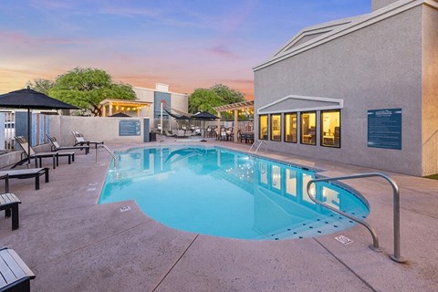 Community Swimming Pool with Pool Furniture at Ridgeline Apartments in Tucson, AZ.