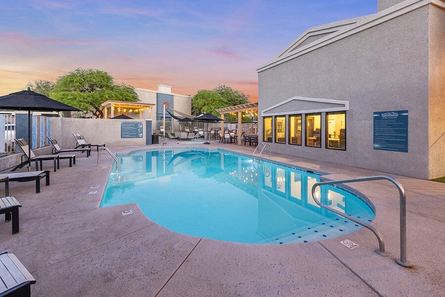 Community Swimming Pool with Pool Furniture at Ridgeline Apartments in Tucson, AZ.