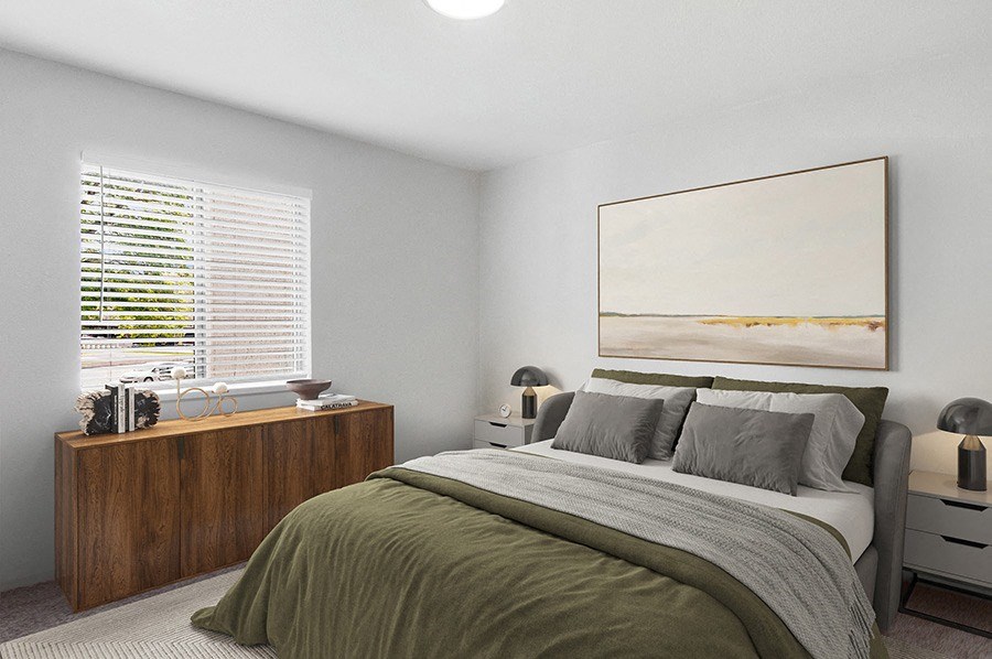Model Bedroom with Carpet and Window View at Monaco Apartments in Salt Lake City, UT.