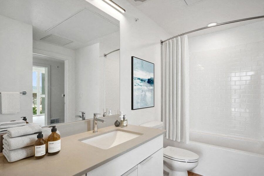 Model bathroom with white vanity at The Register located in Post District Residences in downtown Salt Lake City, Utah