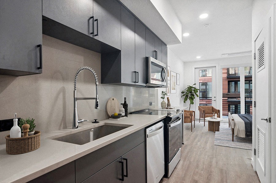 Model kitchen at at Post House North located in Post District Residences in downtown Salt Lake City, Utah