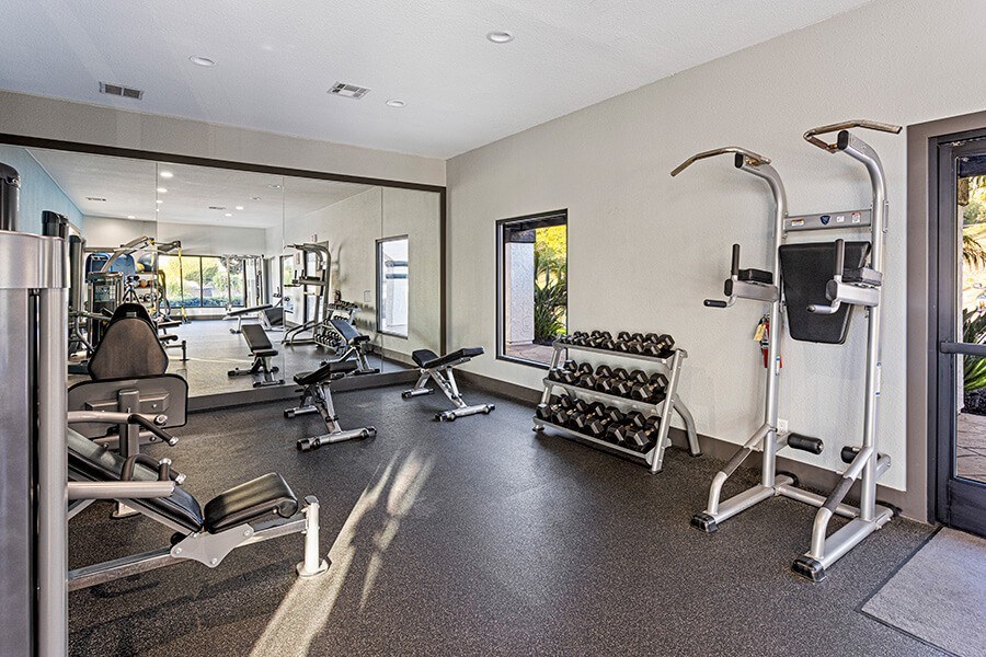 Community Fitness Center with Equipment at Santa Fe Ranch Apartments located in Carlsbad, CA.