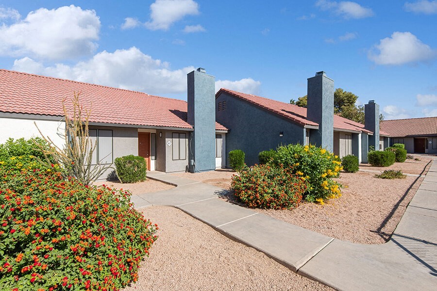 Exterior Community Building and Landscape at Peaks on 4th Apartments in Avondale, AZ.