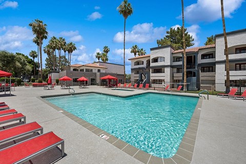 Community Swimming Pool with Pool Furniture at Country Club Verandas Apartments located in Mesa, AZ.