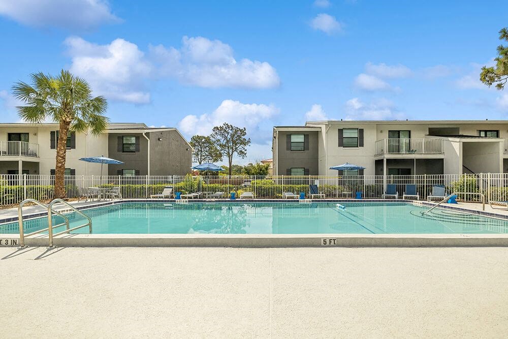 Swimming pool with apartment buildings in the background