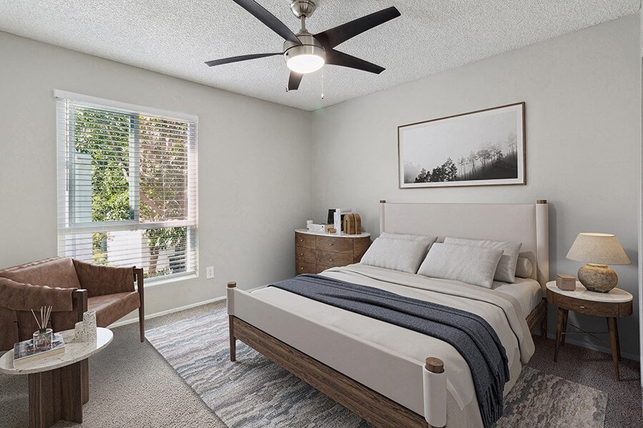 Model Bedroom with Carpet and Window View at Colonnade at Fletcher Hills Apartments in El Cajon, CA.