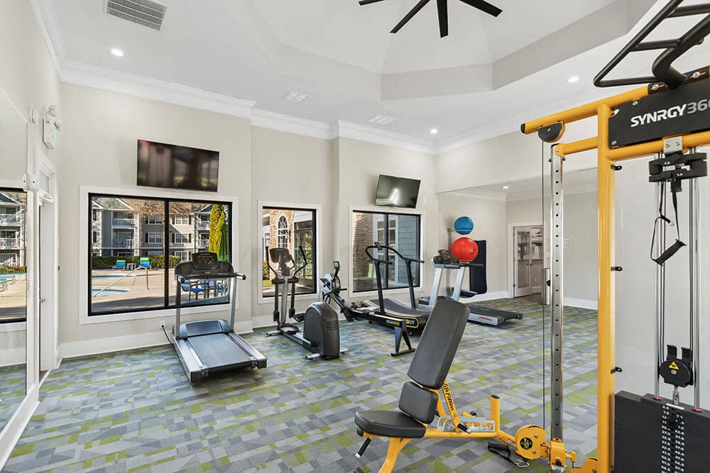 Community Fitness Center with Equipment at Shadow Ridge Apartments in Riverdale, GA.