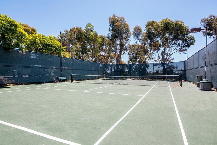 Community Tennis Court with Nets at Santa Fe Ranch Apartments located in Carlsbad, CA.