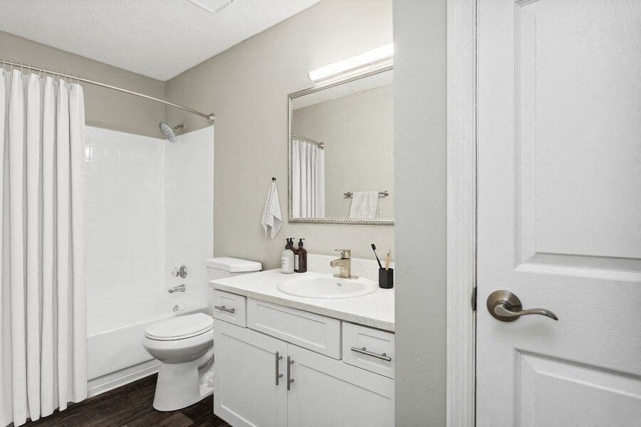 Model Bathroom Two with White Vanity at Caribbean Breeze Apartments in Tampa, FL.