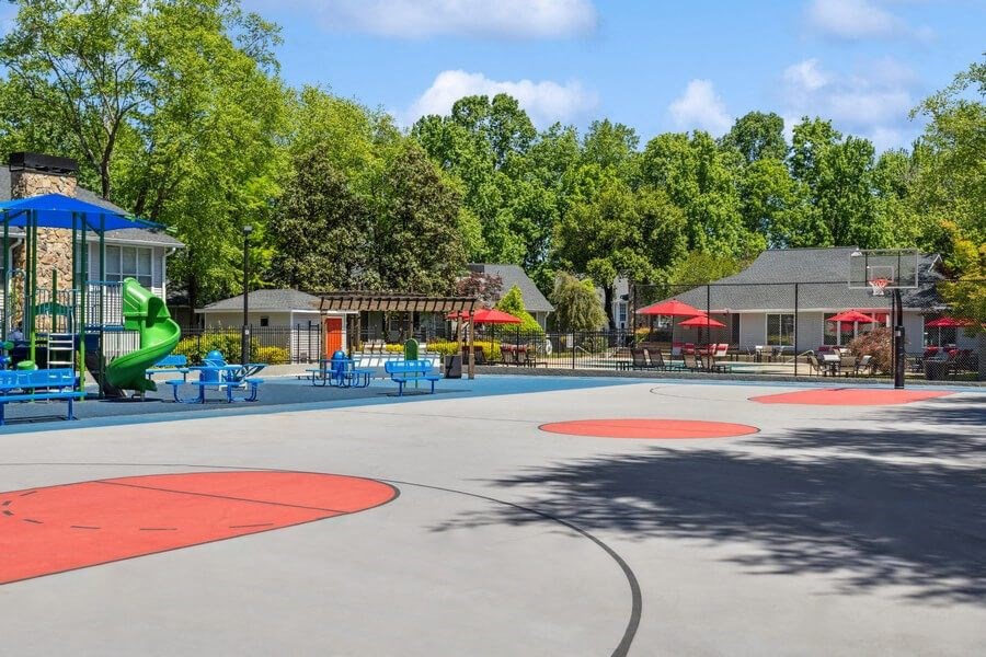 Community Sports Court and Playground Area at Dunwoody Village Apartments in Atlanta, GA.