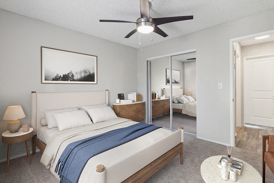 Model Bedroom with Carpet and Closet at Colonnade at Fletcher Hills Apartments in El Cajon, CA.