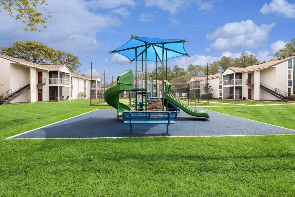 Playground with sun cover at Vue at Baymeadows Apartments in Jacksonville, Florida