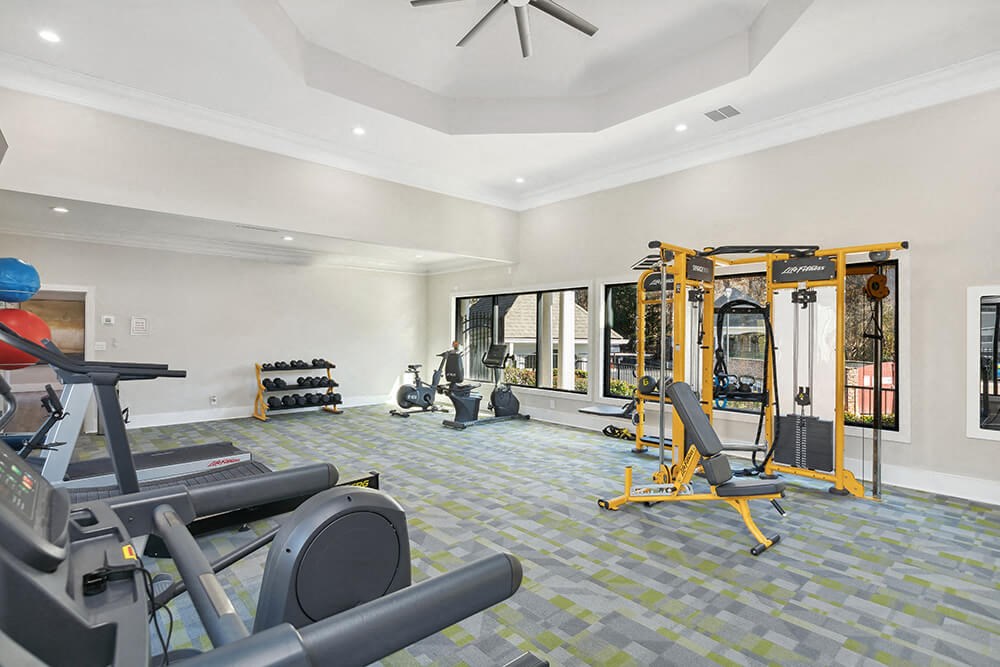 Community Fitness Center with Equipment at Shadow Ridge Apartments in Riverdale, GA.