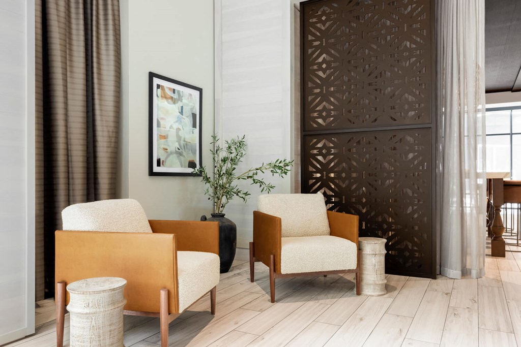 Lounge area with two chairs and decorative vase