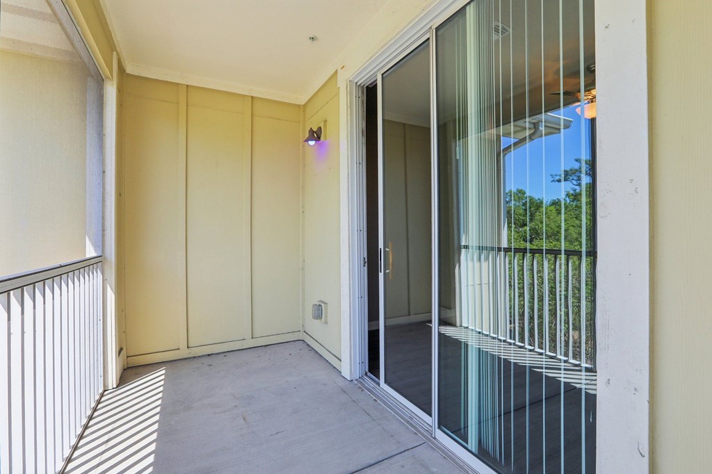 Model balcony with sliding glass door.