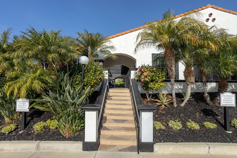 Exterior Community Building and Landscape at Santa Fe Ranch Apartments located in Carlsbad, CA.