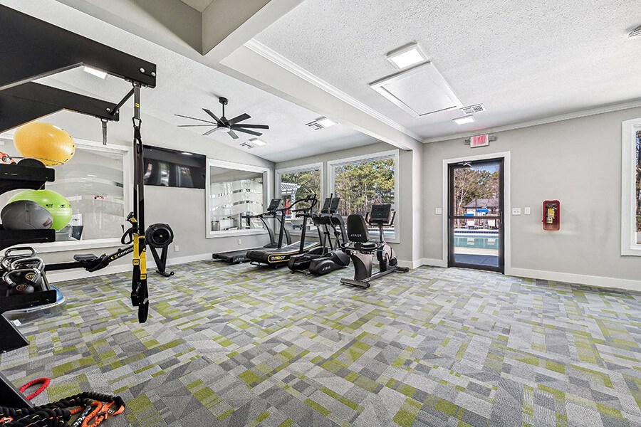 Community Fitness Center with Equipment at Paramont Apartments in Duluth, GA.
