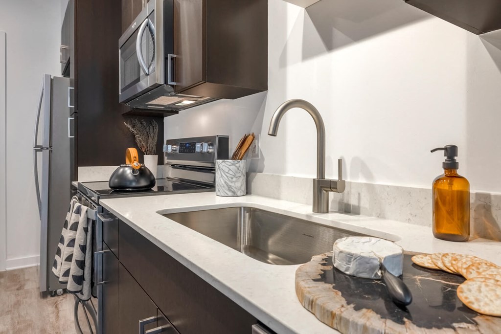 Model kitchen with undermount sink and a microwave