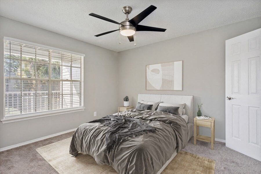 Model Bedroom One with Window View at Caribbean Breeze Apartments in Tampa, FL.