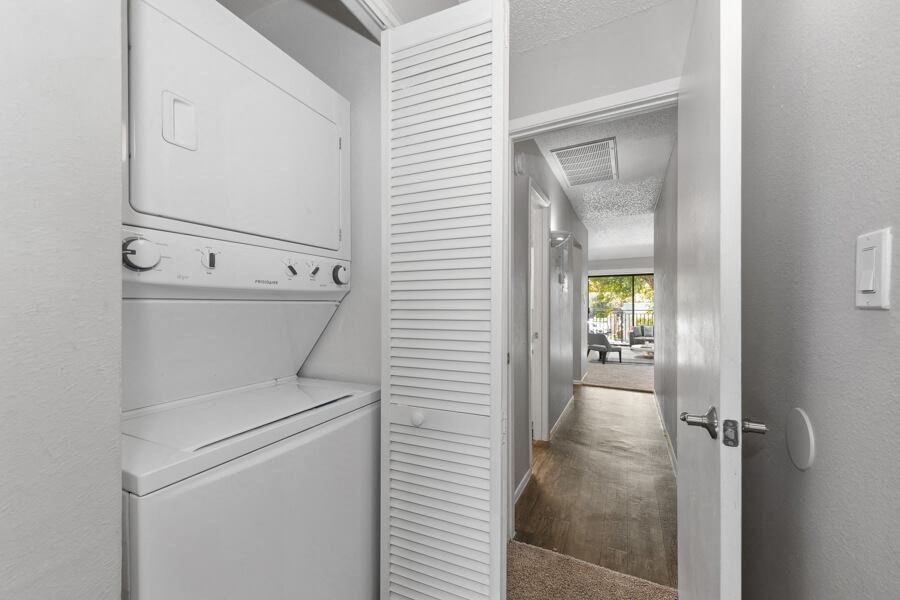 Washer and dryer and hallway in an apartment at Verona Park, Mesa, 85210