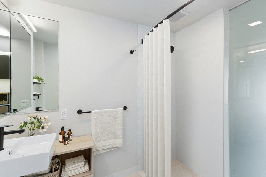 Model bathroom with shower and black hardware