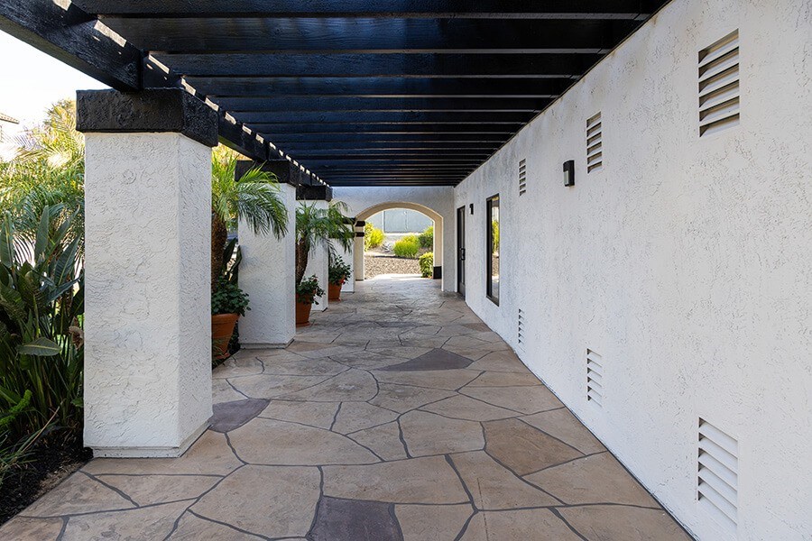 Exterior Community Building and Landscape at Santa Fe Ranch Apartments located in Carlsbad, CA.