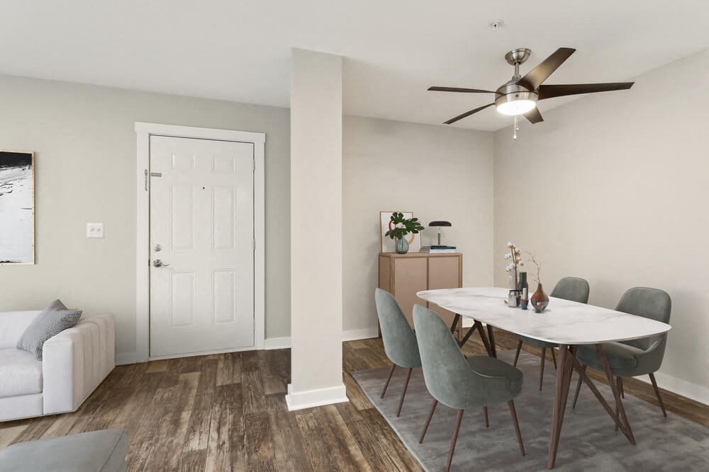 Model dining area with a table and chairs and a ceiling fan