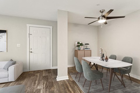 Model dining area with a table and chairs and a ceiling fan