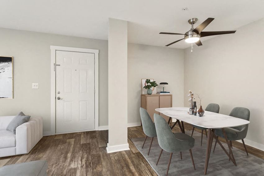 Model dining area with a table and chairs and a ceiling fan - Photo Gallery