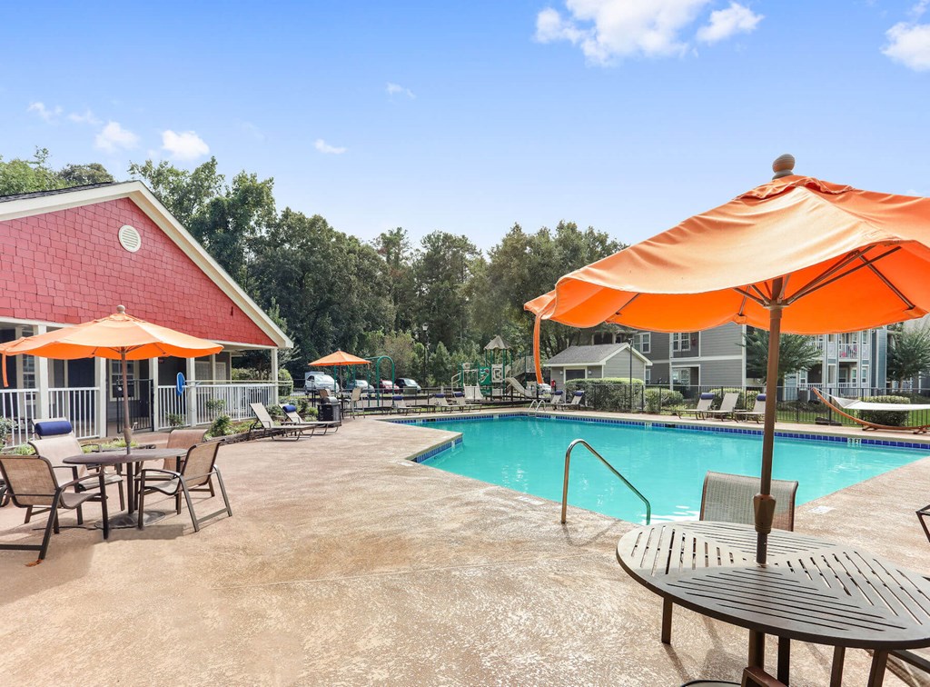 Poolside cabanas and picnic tables