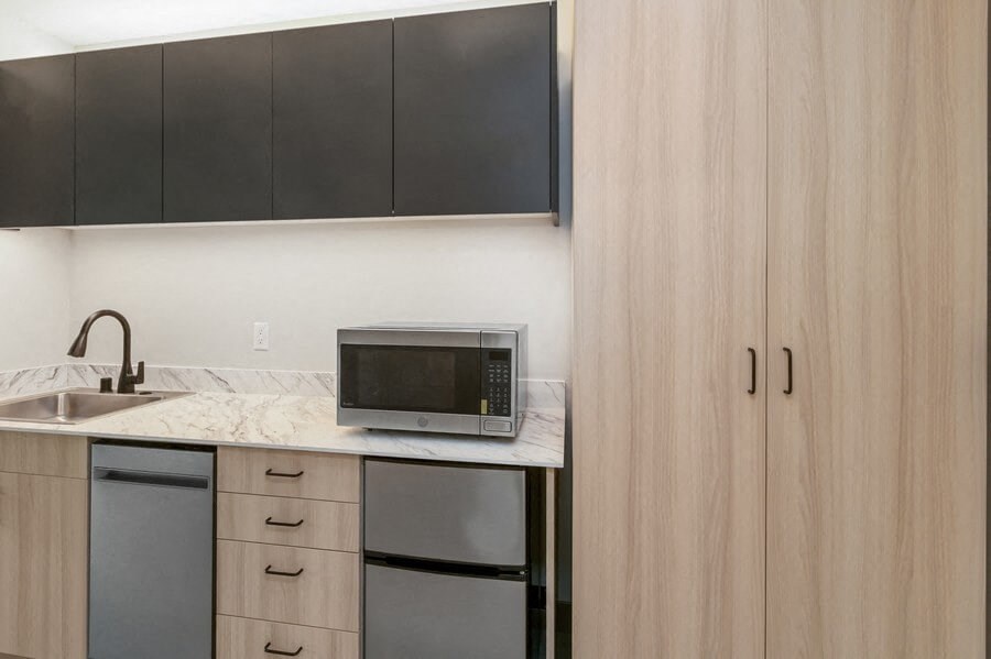 Model kitchen with mini fridge and microwave