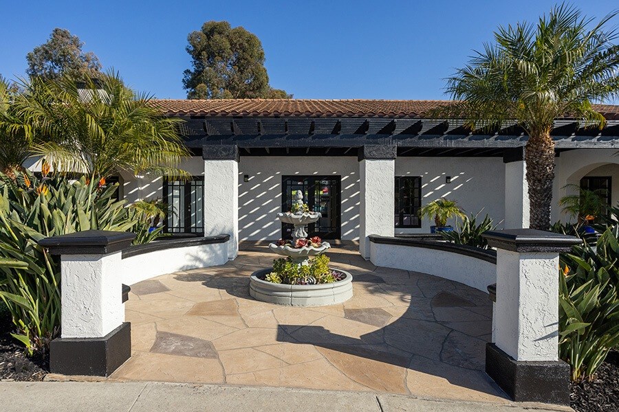 Exterior Community Building with Fountain and Landscape at Santa Fe Ranch Apartments located in Carlsbad, CA.