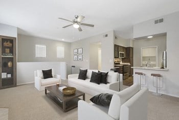 Model living room and kitchen in the back