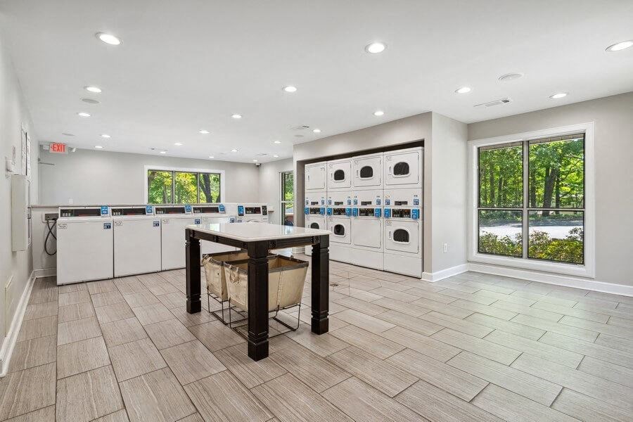 Community Laundry Center with Washing Machines and Dryers at Dunwoody Village Apartments in Atlanta, GA.