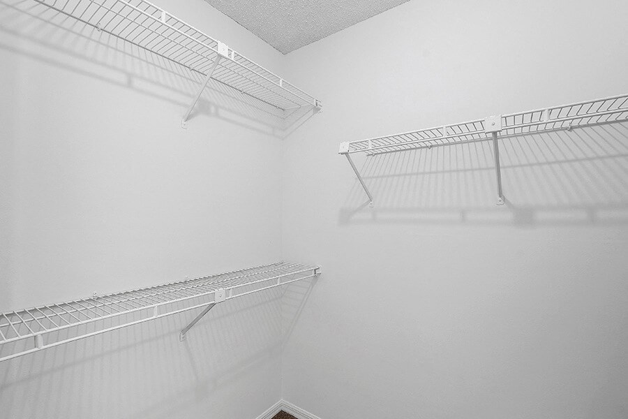 Model Bedroom Closet with Carpet at Fountains Lee Vista Apartments in Orlando, FL.