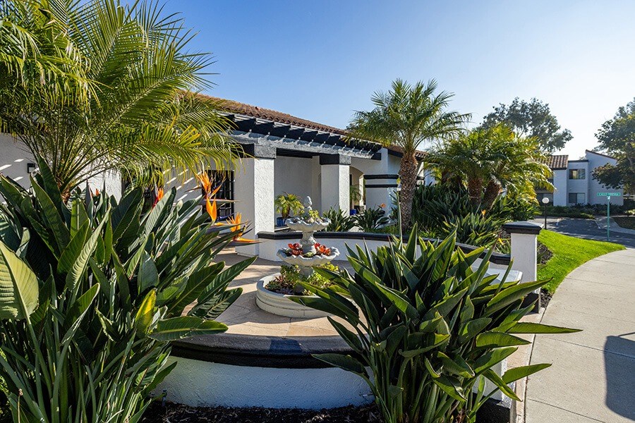 Exterior Community Building with Fountain and Landscape at Santa Fe Ranch Apartments located in Carlsbad, CA.