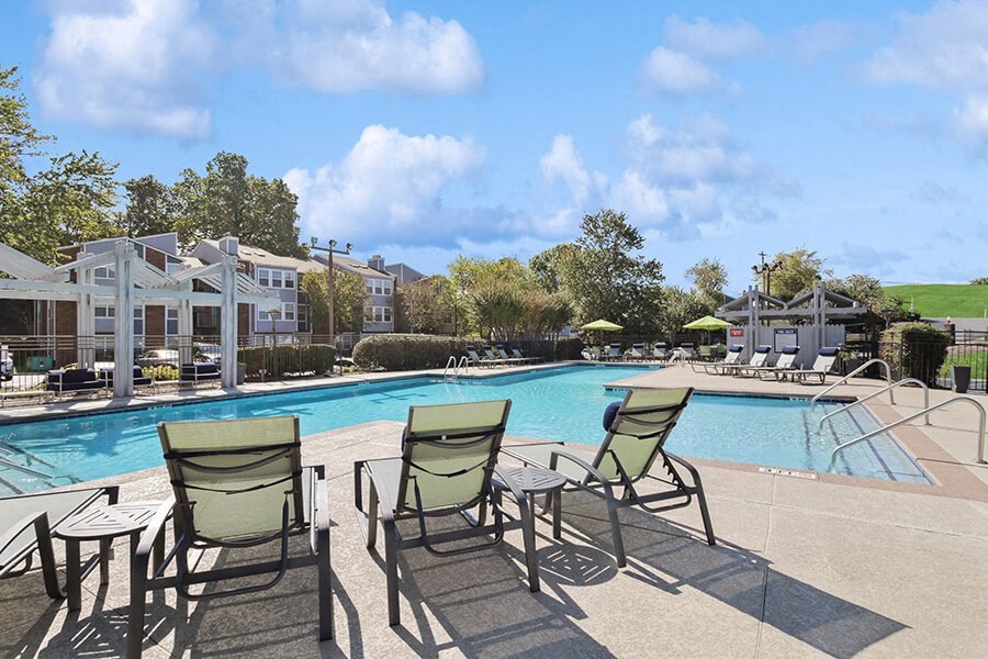 Community Swimming Pool with Pool Furniture at Abbington Heights Apartments in Antioch, TN.