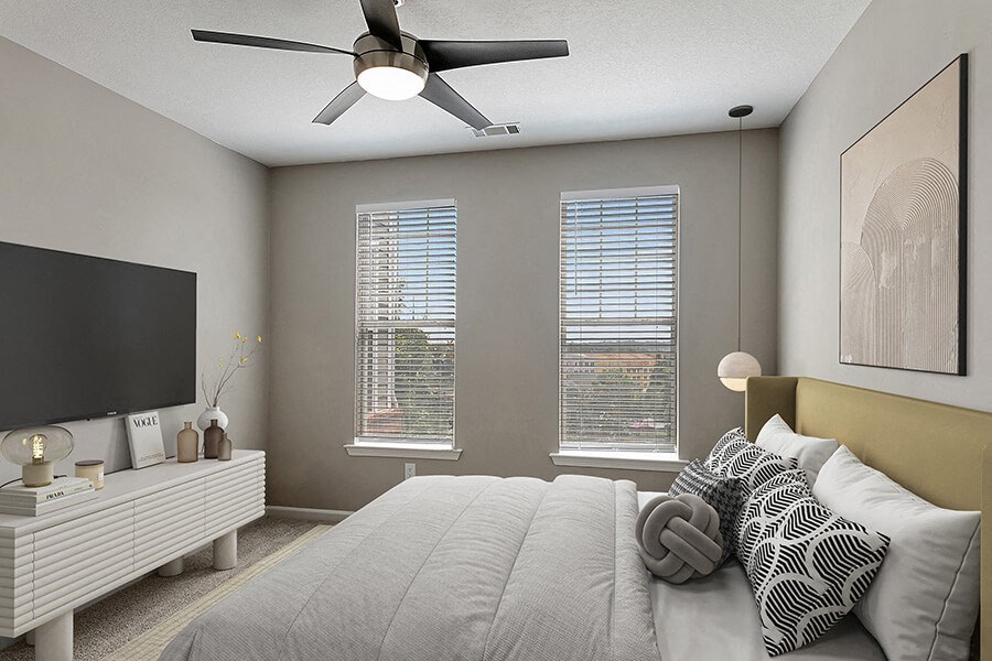 Model Bedroom with Carpet and Double Window View at Parkside at Town Center Apartments in Marietta, GA.