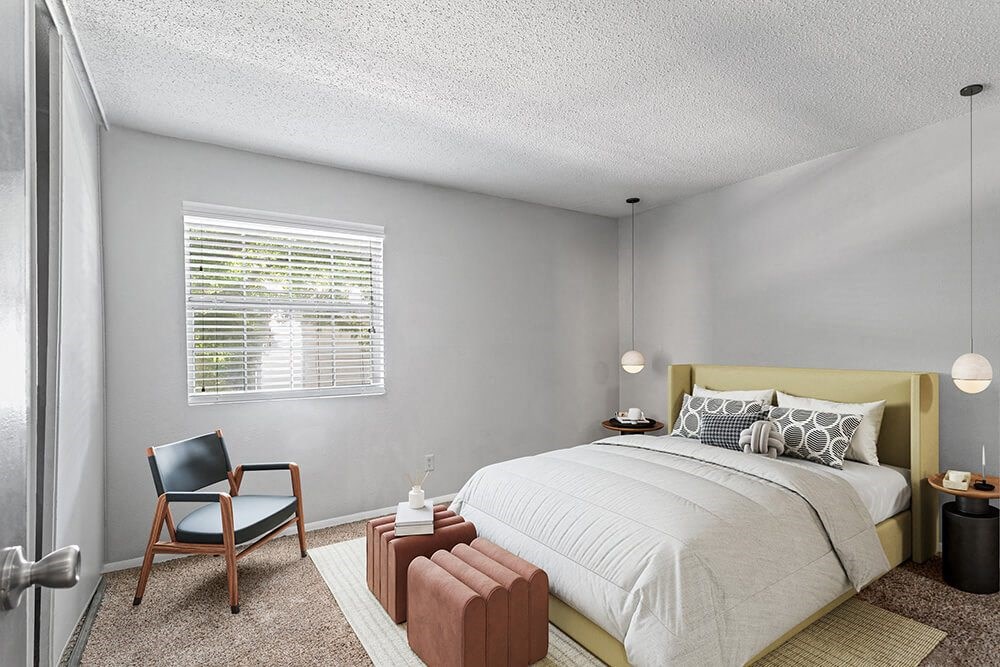 Model Bedroom with Carpet and Window View at Corners at 1700 Apartments in Atlanta, GA.