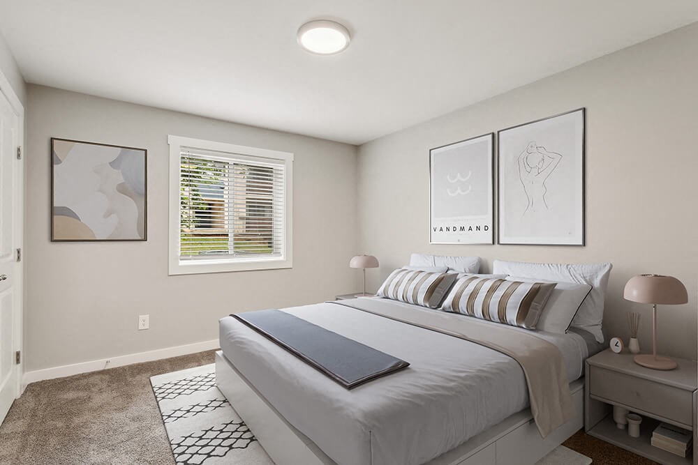 Model bedroom with a bed and a window