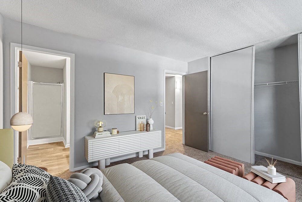 Model Bedroom with Carpet and attached Bathroom at Corners at 1700 Apartments in Atlanta, GA.