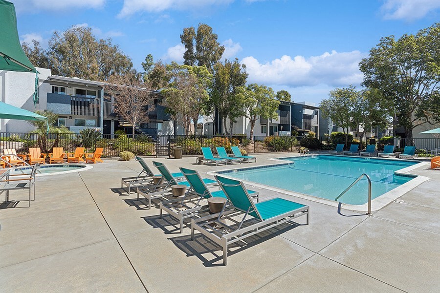 Community Swimming Pool with Pool Furniture at Colonnade at Fletcher Hills Apartments in El Cajon, CA.