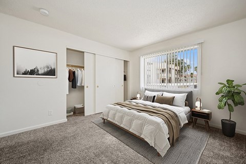 Model Bedroom with Carpet and Large Closet at Butler Ridge Apartments located in Glendale, AZ.