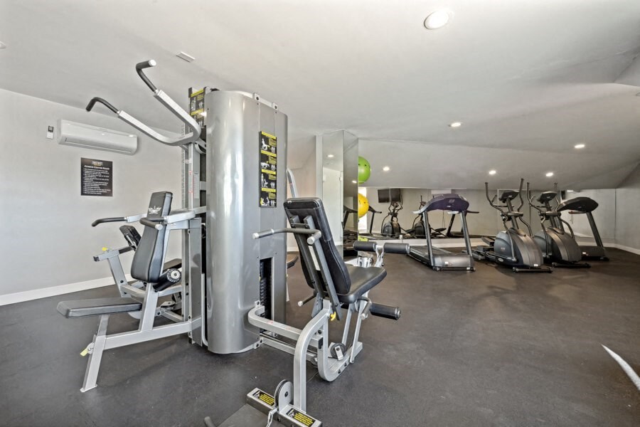 the gym at District at Fiesta Park apartments