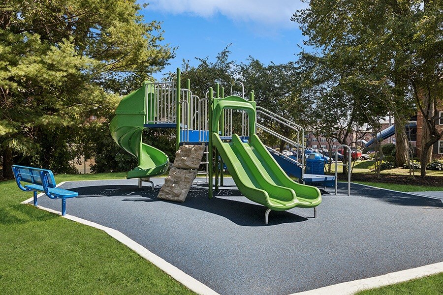 Community Playground with Two Slides at Middlesex Crossing Apartments located in Billerica, MA.
