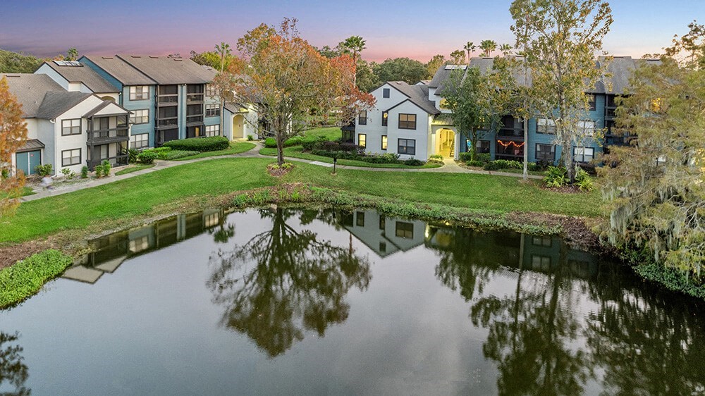 Aerial View of Community Pond and Exterior Building at Fountains at Lee Vista Apartments in Orlando, FL.