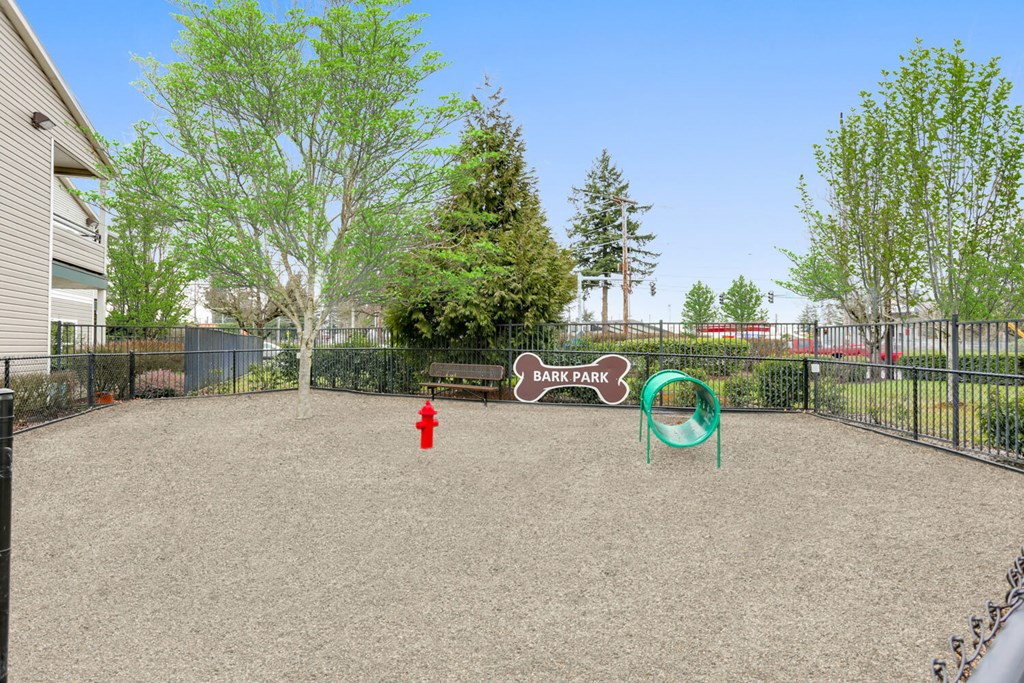 Community Dog Park with Agility Equipment at Landings at Morrison Apartments located in Gresham, OR.