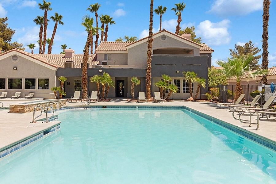 Community Swimming Pool with Pool Furniture at Verraso Apartments in Las Vegas, NV.