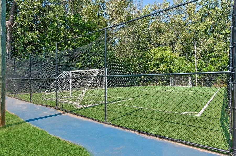 Community Soccer Field with Nets and Walking Track at Stoney Trace Apartments in Charlotte, NC.