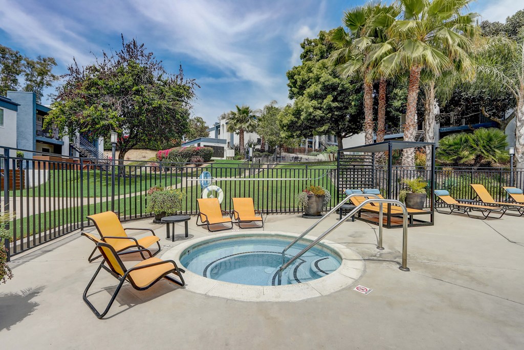 Community Hot Tub with Lounge Furniture at Cove La Mesa Apartments located in La Mesa, CA.